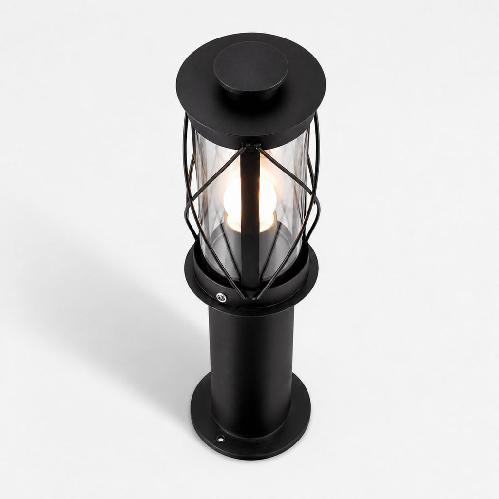 Lucia 40cm black bollard post light, angled view showing the crossed cage and clear glass