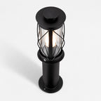 Lucia 40cm black bollard post light, angled view showing the crossed cage and clear glass