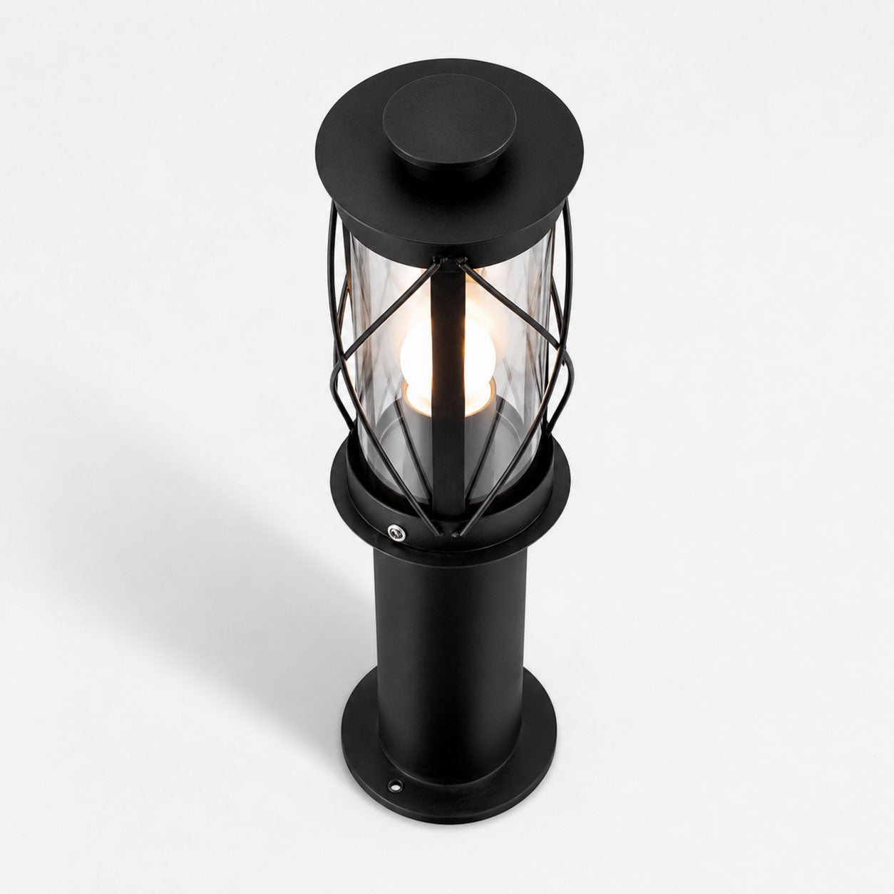 Lucia 40cm black bollard post light, angled view showing the crossed cage and clear glass
