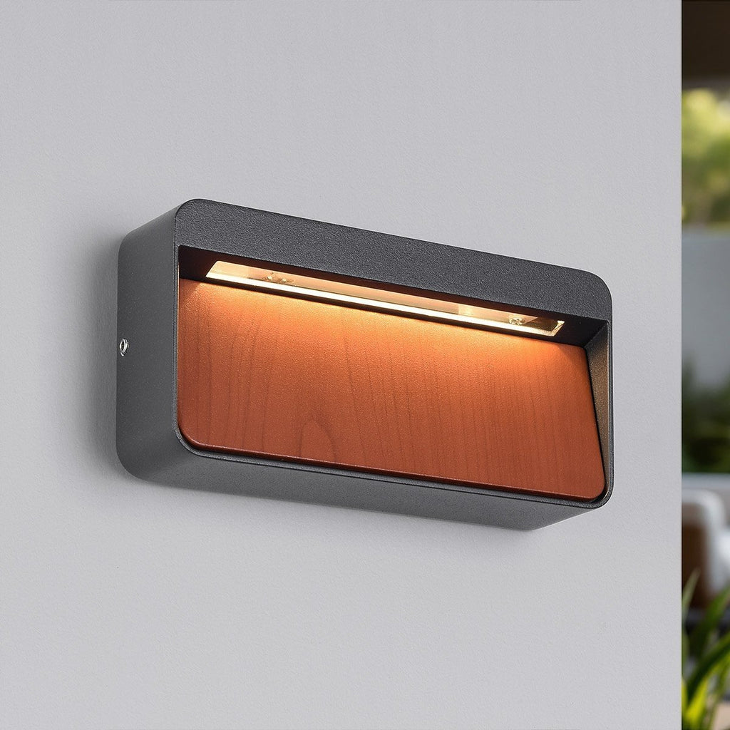 Loren LED outdoor wall light in anthracite grey with natural wood accent mounted on exterior wall