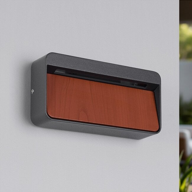 Close up of Loren anthracite and wood LED wall light showing design detail and warm LED illumination